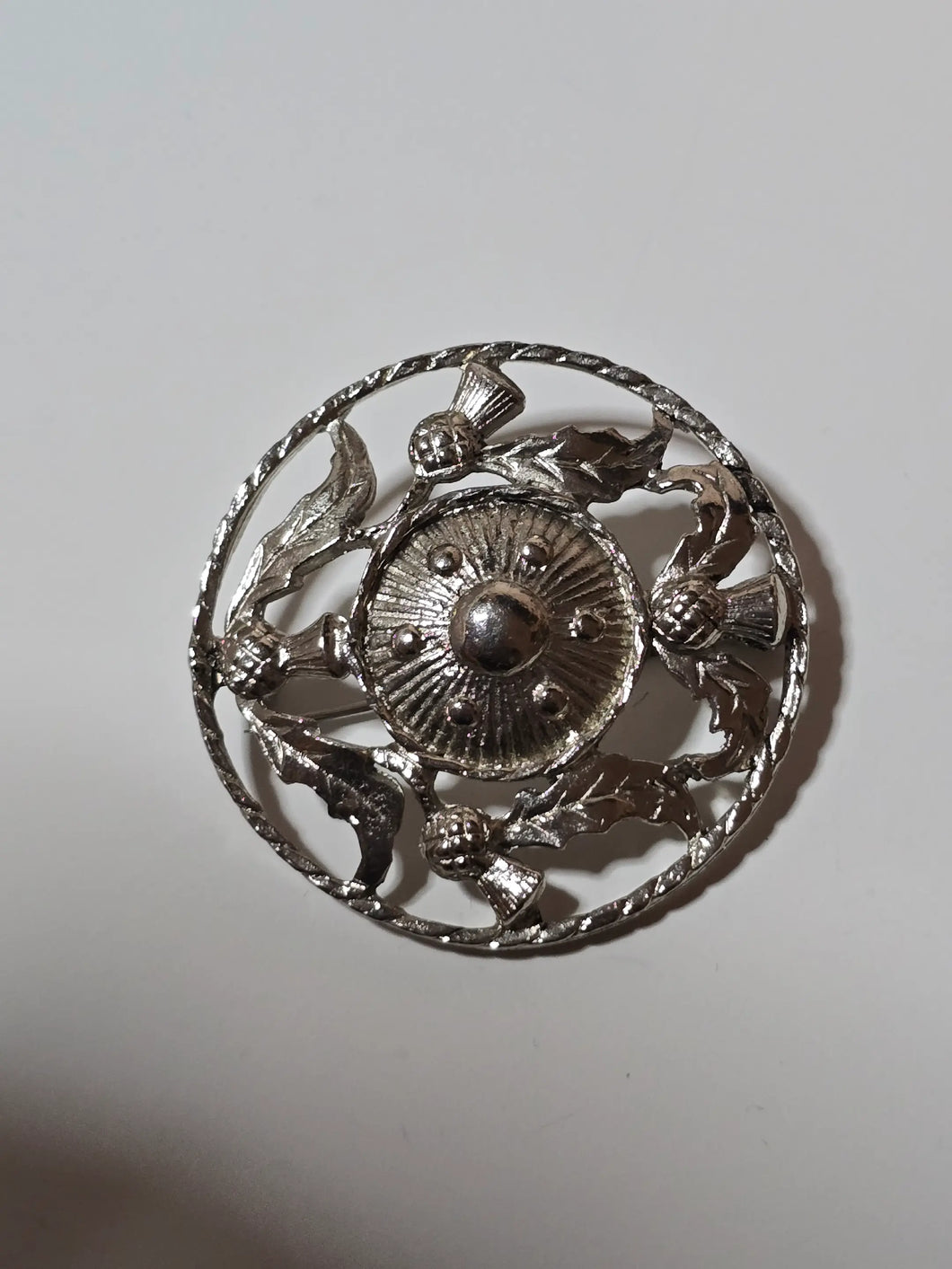 Silver tone brooch