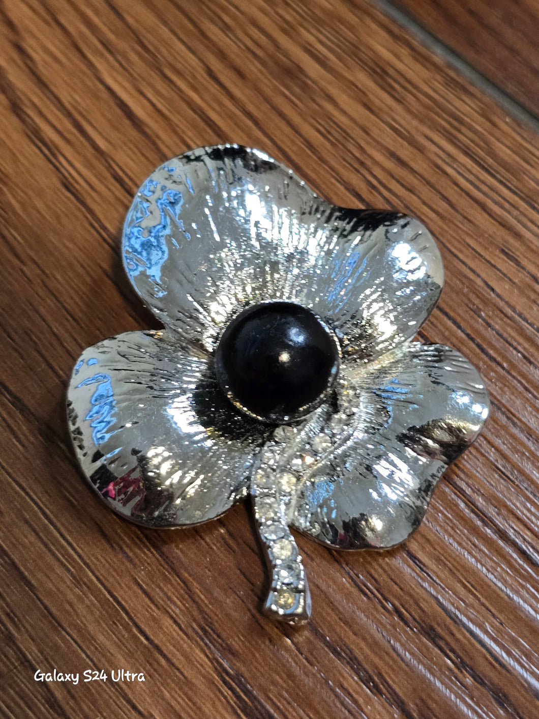 Silver tone flower brooch