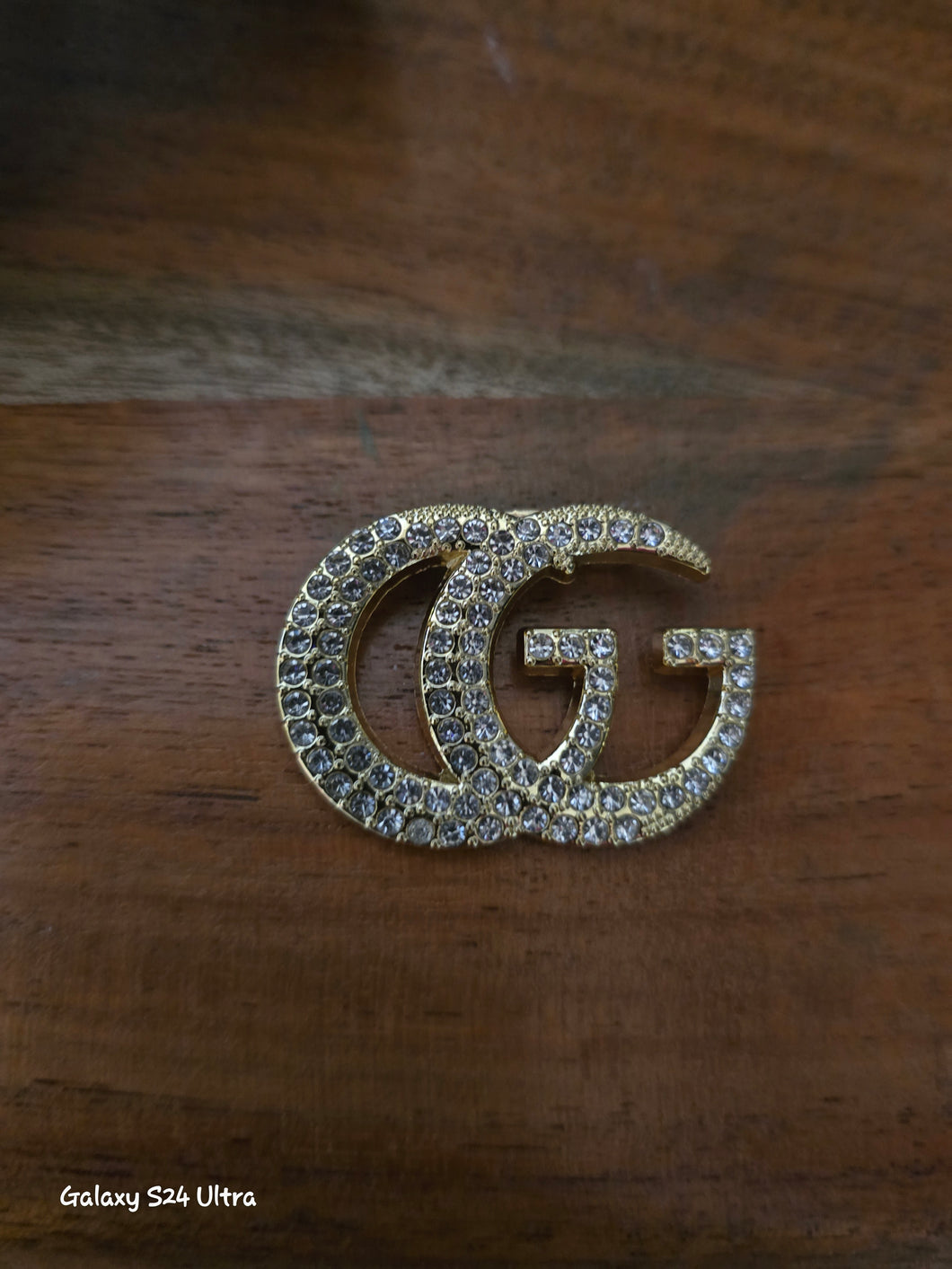 Gucci gold tone brooch