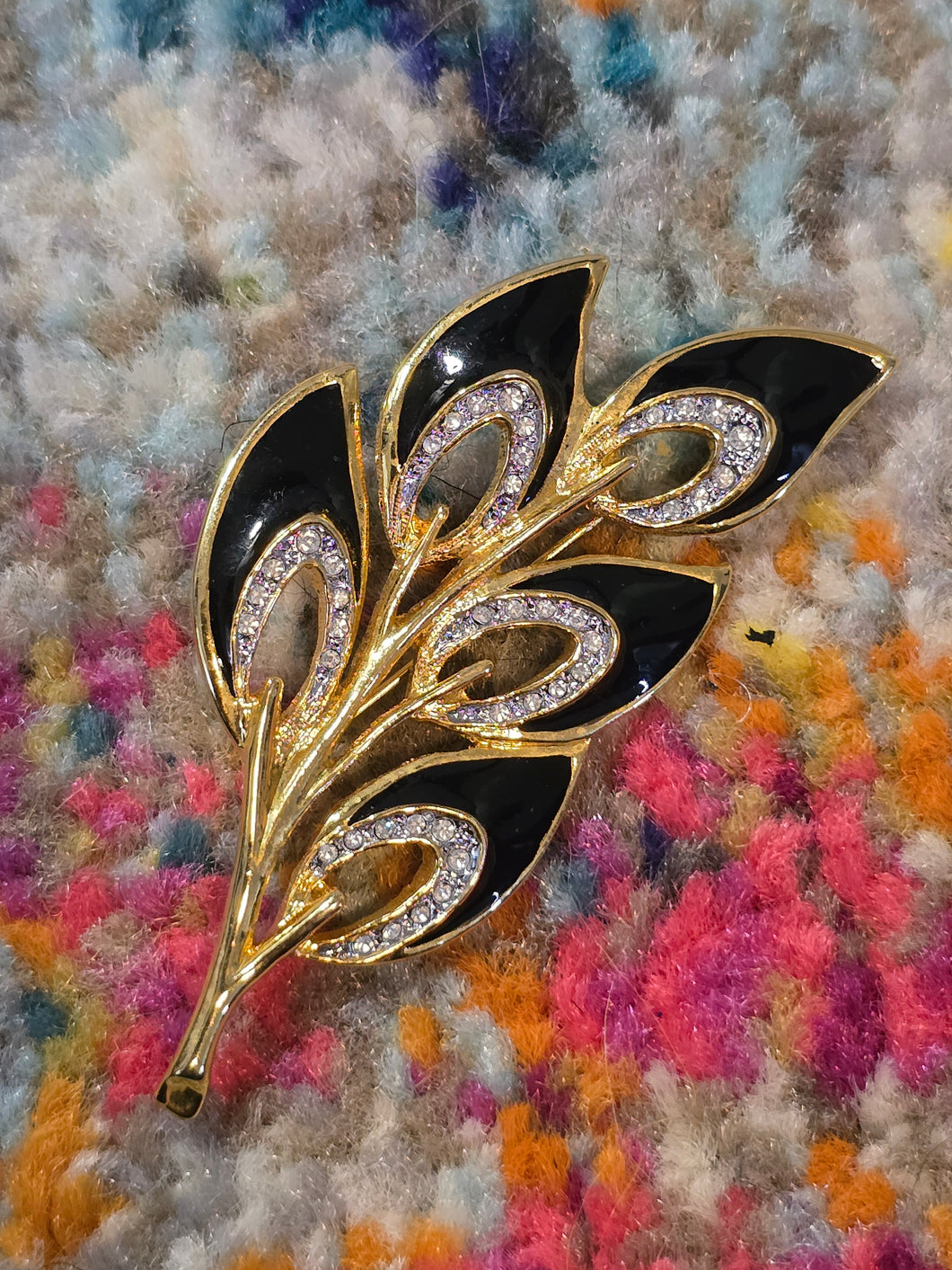 Black enamel brooch